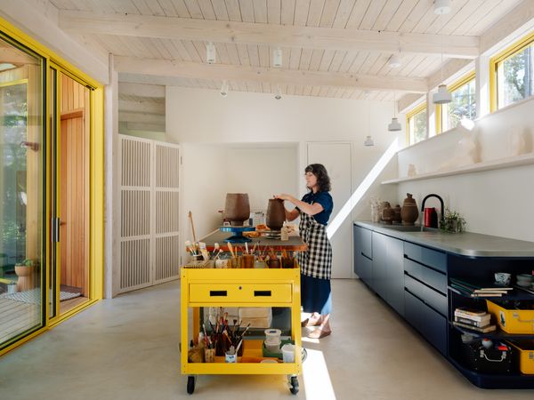 For the sink area in homeowner Annalisa Chasan's sculpture studio space, "Max and Tyler came up with the zinc countertop," says her husband Alex Martin. "It's cool to be working on a living finish." Here, sunlight streams in from street-facing clerestory windows, a feature the homeowners requested.