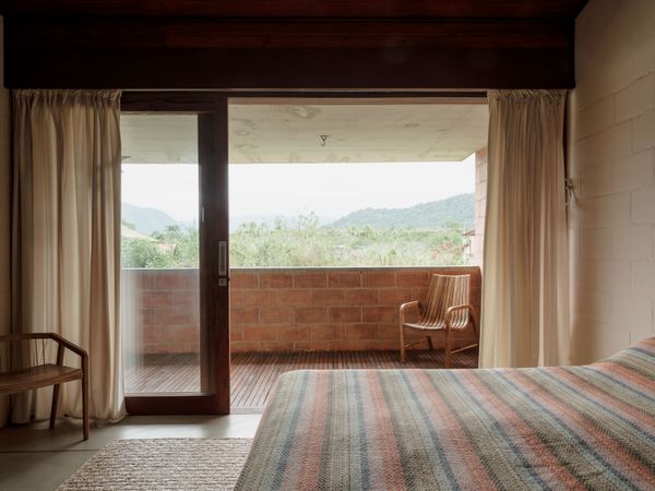 A suite of pieces by Abigail Turin, including the bed, desk, and shelving, unifies the bedroom’s design.