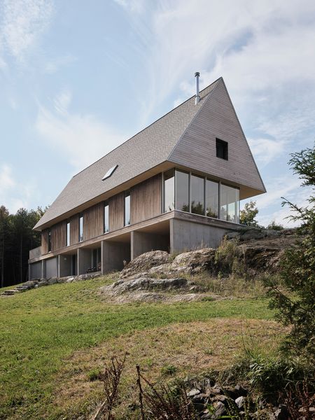 The eastern cedar cladding will develop a gray patina over time.