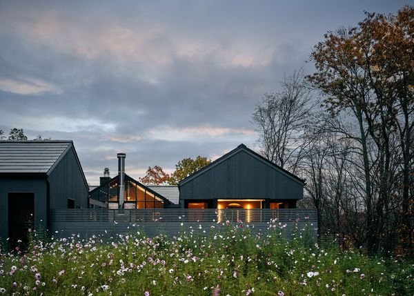 Exterior view, greenhouse, primary bath, and wild flowers 