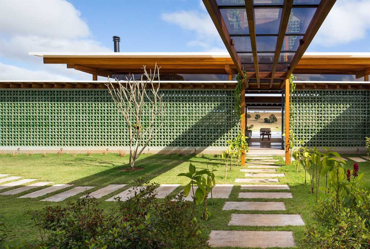 Breeze-Block Walls Add to the Airy Atmosphere of a Lakefront Home in Brazil