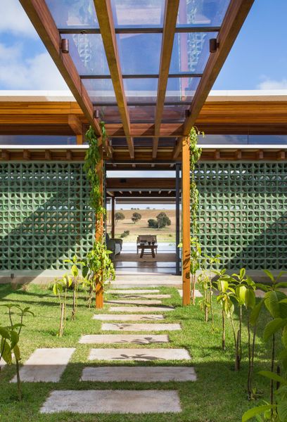 Breeze-Block Walls Add to the Airy Atmosphere of a Lakefront Home in Brazil