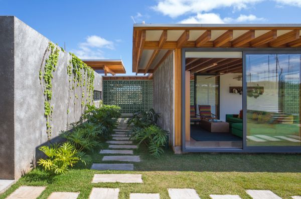 Breeze-Block Walls Add to the Airy Atmosphere of a Lakefront Home in Brazil
