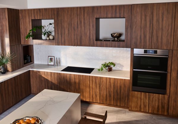 The walnut millwork in the Dacor concept kitchen is a stand-out example of how natural materials can be used to create a warm and welcoming kitchen.