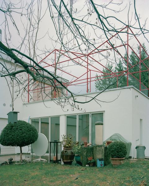 Red Piping Punches Up a Liechtenstein Home Split Into Two Units