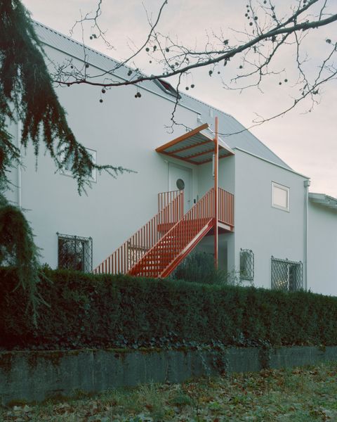 Red Piping Punches Up a Liechtenstein Home Split Into Two Units