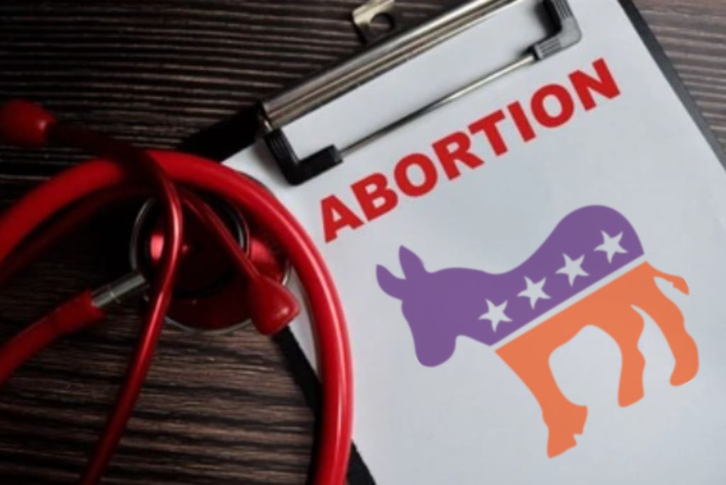 Stethoscope and clipboard with the word "ABORTION" and a donkey symbol, representing political discussions on reproductive rights.