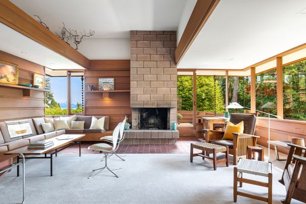 A wood-burning fireplace provides additional heat to the living room.