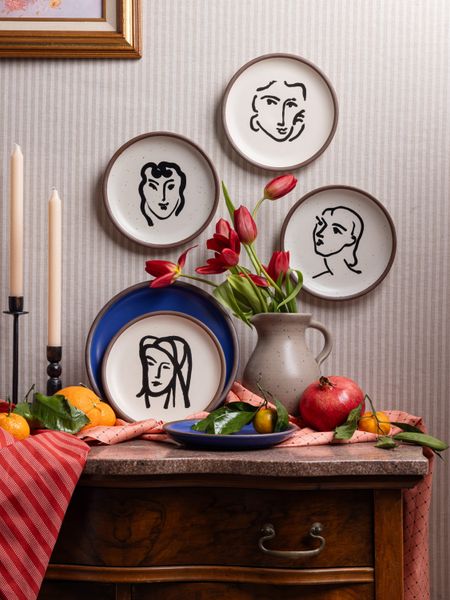 A collection of side plates in a panna cotta colorway from East Fork features aquatint portraits by Henri Matisse.
