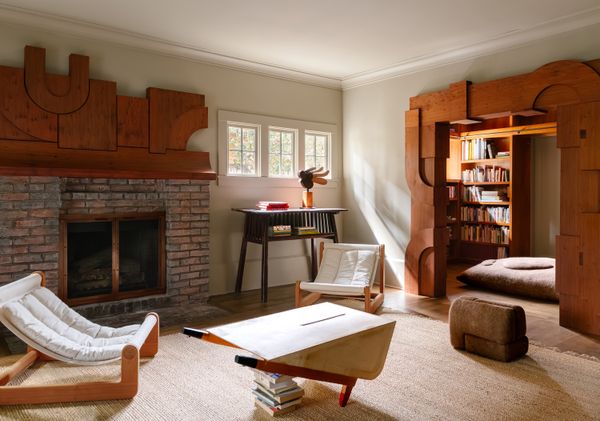 Design firm Studio AHEAD and wood sculptor Ido Yoshimoto created a fireplace mantel and a threshold for a couple's Berkeley home.