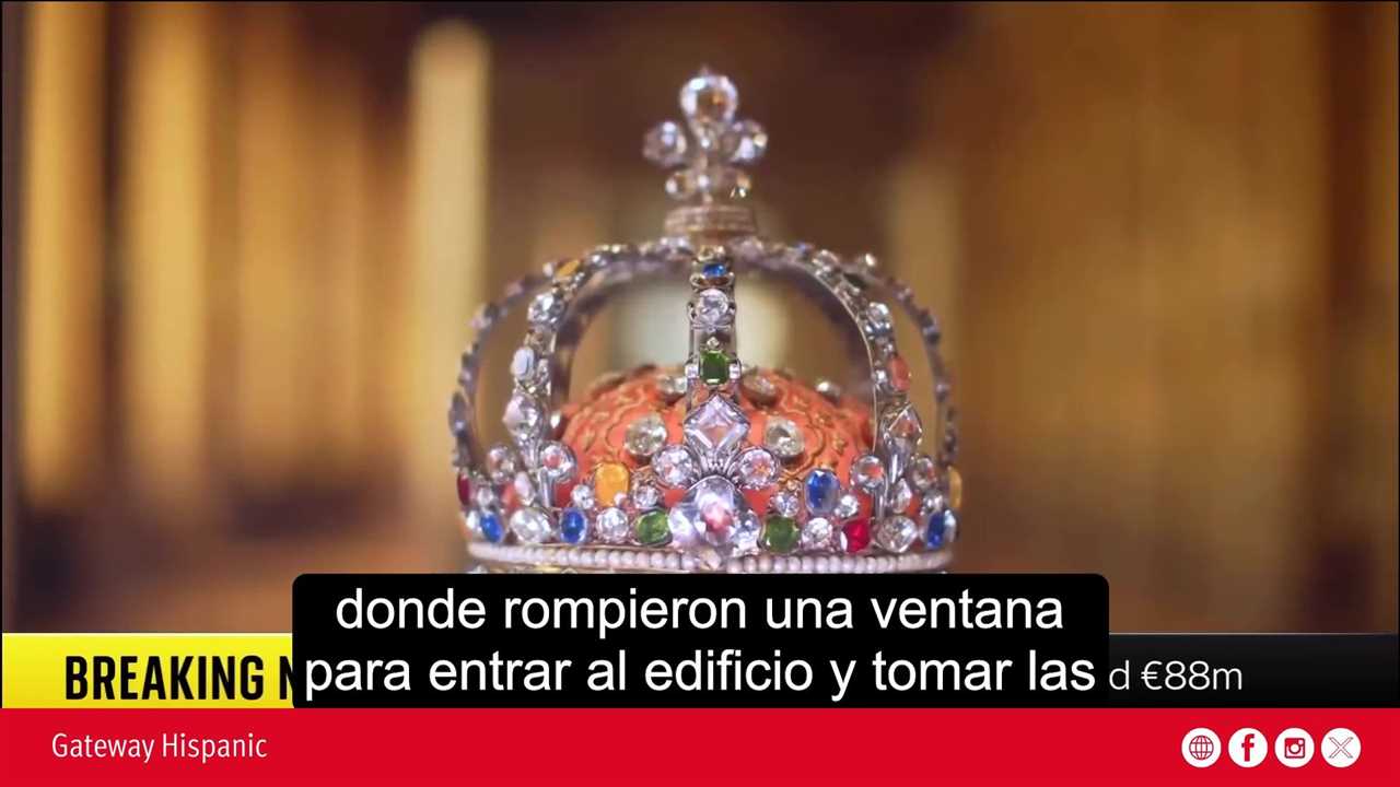 Close-up of an ornate crown featuring colorful gemstones, highlighting its intricate design and craftsmanship against a blurred background.