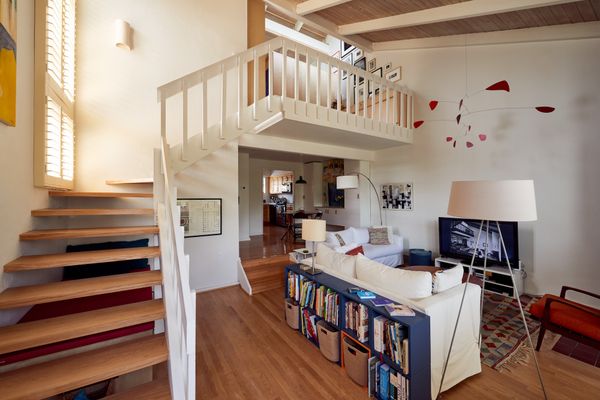 Architect Marisa Kurtzman, a partner at Frederick Fisher Partners in Los Angeles, transformed the upstairs loft of her family's 1,100-square-foot condo by designing a multipurpose functional partition dubbed "the Superwall.