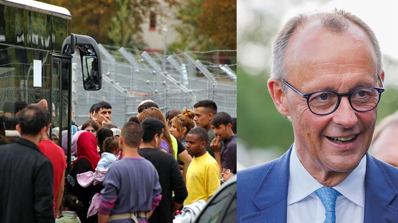 Crowd of refugees gathered near a bus at a border facility, with a smiling man in a suit in the foreground, representing migration and humanitarian issues.