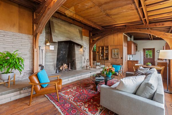 The home's steel windows and the raised-hearth fireplace are Bernard Maybeck, one of the Bay Area's most notable architects, staples.
