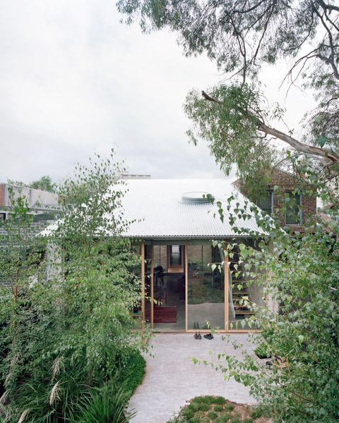Four Massive Pivot Doors Bring the Outdoors In at This Australian Family Home