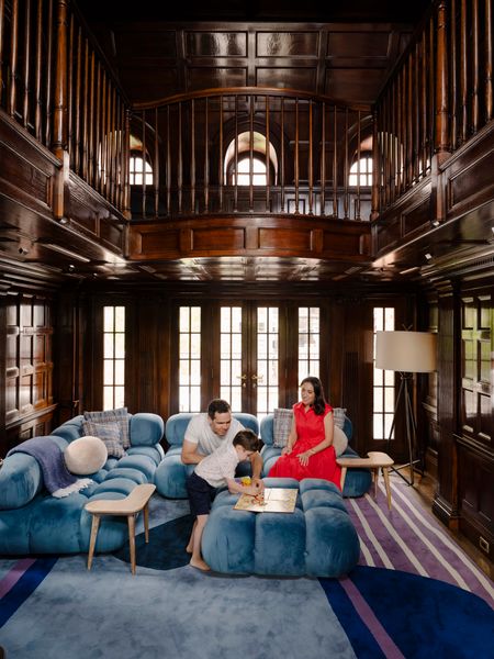 The couple play with their four-year-old, Ben, play in the townhome’s 1970s penthouse addition. Adrienne says it was the most difficult part of the project.