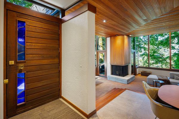 Massive Windows Fill This $1.1M Oregon Midcentury With Forest Views
