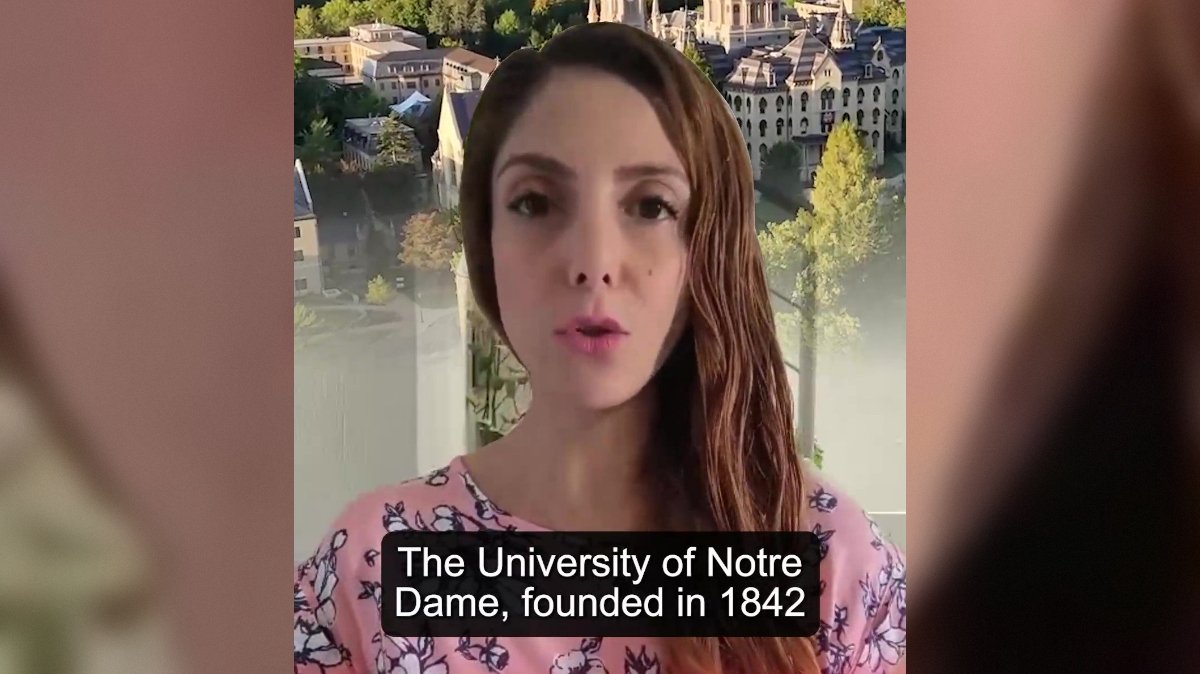 Woman speaking about the University of Notre Dame, founded in 1842, with a scenic campus background.