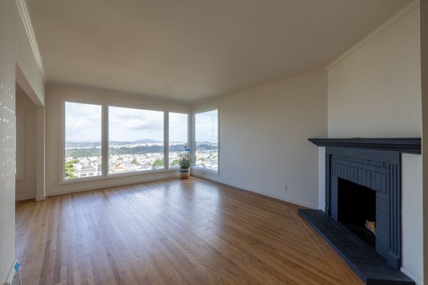 Before: Little was changed in the living room, save for the mantelpiece.