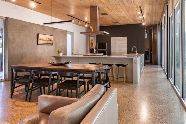 Cross the Bridge to Enter This $1.4M Dallas Home Wrapped in Cor-Ten Steel