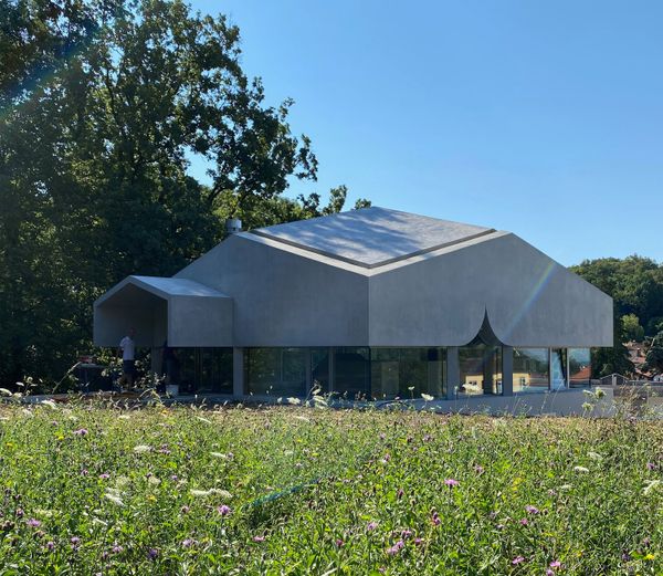 A Ribbon of Windows Wraps This Concrete Cabin in Switzerland