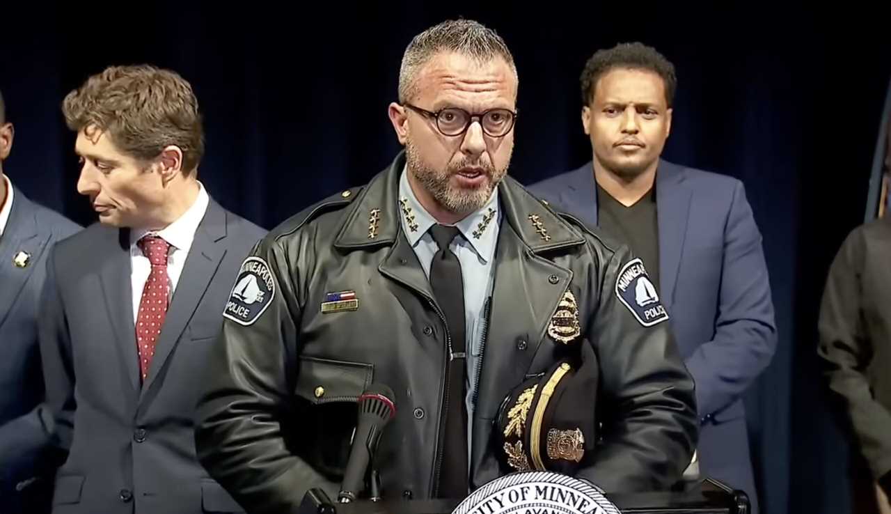 Minneapolis police chief addresses the media during a press conference, flanked by city officials, discussing public safety and community relations.