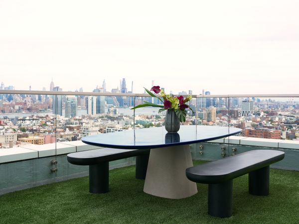 A table and chair set from B&B Italia sits on the expansive balcony.