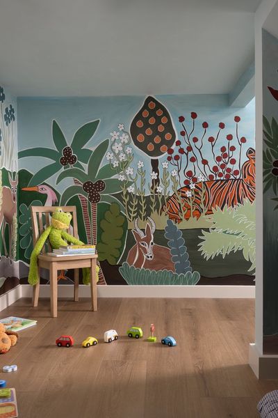 This custom playroom is hidden behind a secret door accessed through a media console and is a cute space for the kids to call their own.