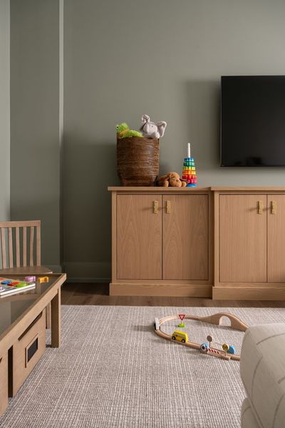 The entrance to the secret playroom is accessed through a custom media console that, when closed, looks like nothing other than what it is.