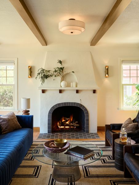 The fireplace itself was an original feature in the Tudor Revival living room, but the original tile was chipped, stained, and needed a refresh.