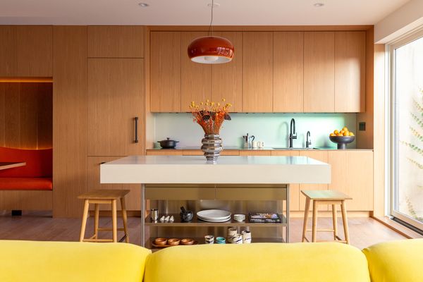 The kitchen island is custom, and the backsplash against the wall is from Bendheim.
