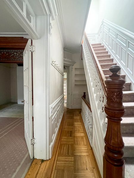 Before: The team removed the carpet and refinished the stairs and railing.