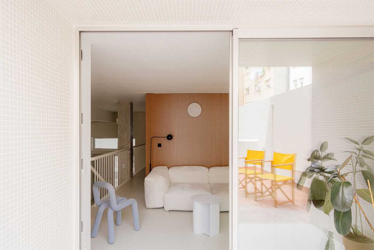 The Staircase in This Small Spanish Apartment Hides a Secret Toilet