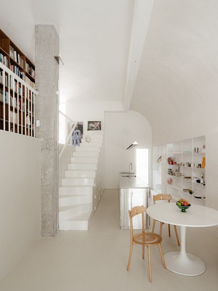 The Staircase in This Small Spanish Apartment Hides a Secret Toilet