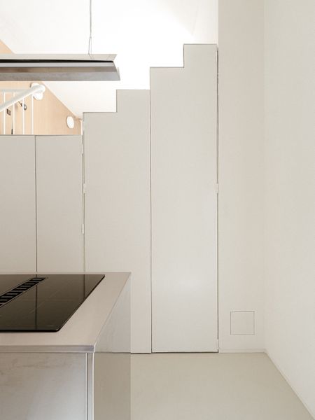 The Staircase in This Small Spanish Apartment Hides a Secret Toilet