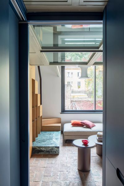 A Glass-Floor Mezzanine Shatters Conventions in This Reworked Rome Apartment