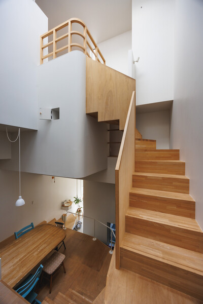 Local firm FujiwaraMuro Architects created numerous split levels stacked atop one another to accommodate the unconventional family home on a 