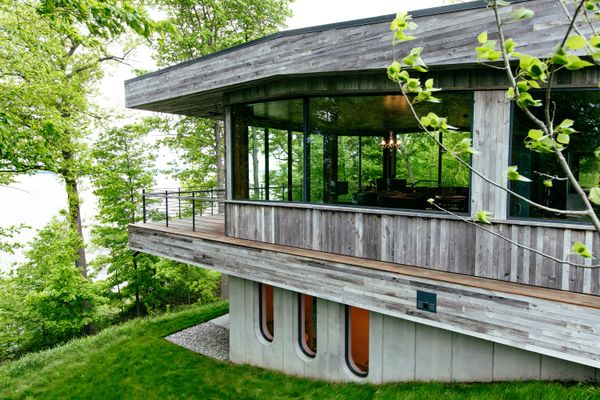 The whole building is nestled into the earth, making the surrounding woods feel even closer. 