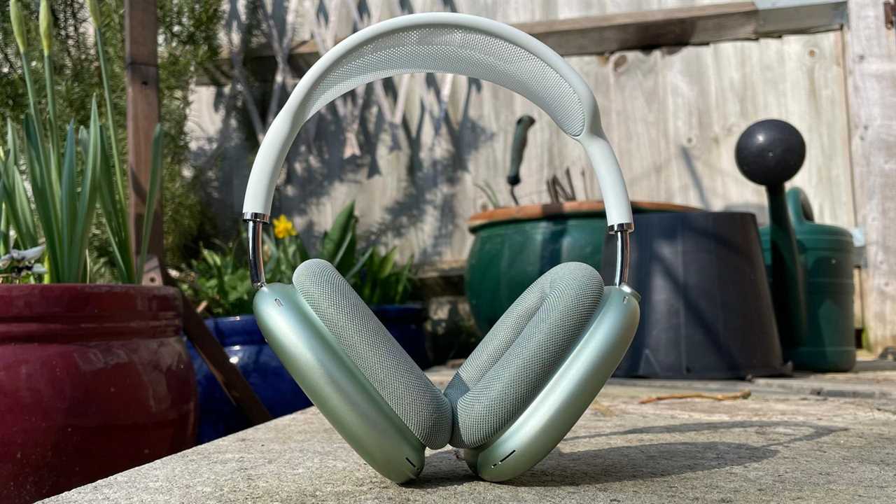 AirPods Max in green upright on a table