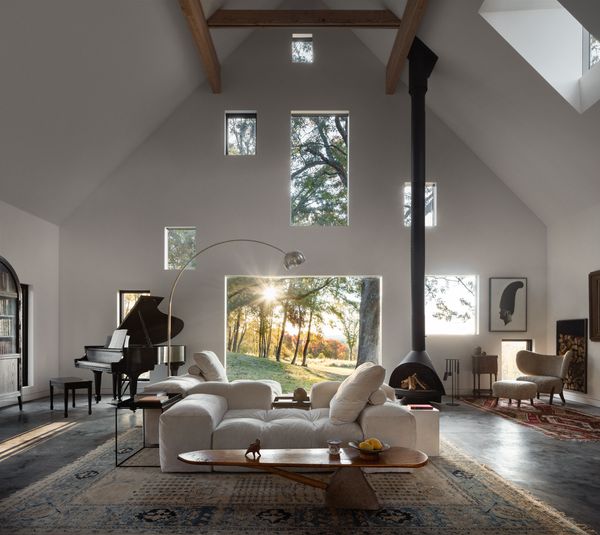 Brooklyn-based architecture firm Estudio Esmero worked within the foundation and steel structure of an existing carriage house in upstate New York for this new build, which features concrete floors with bright gold kintsugi details.