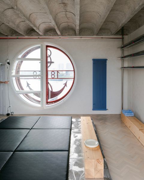 Steel Scaffolding Forms a Bed and Wardrobe in This Small Slovakia Apartment