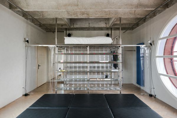 Steel Scaffolding Forms a Bed and Wardrobe in This Small Slovakia Apartment