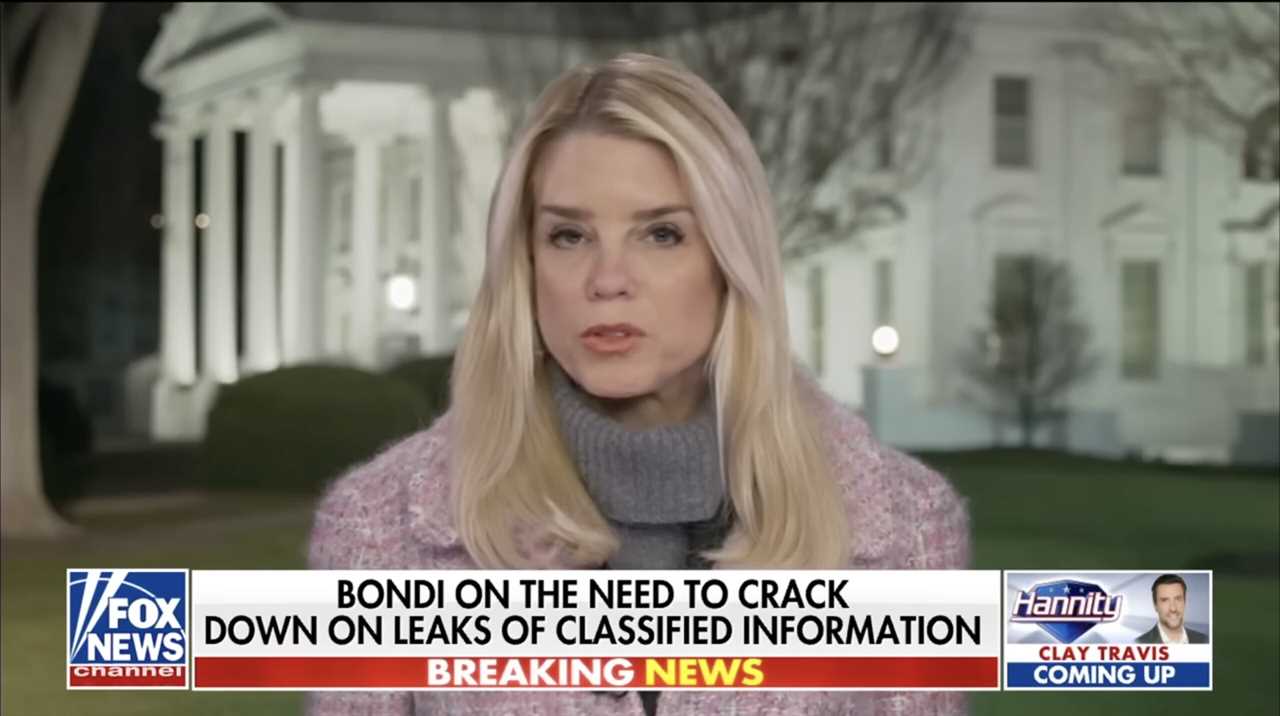 Breaking news segment featuring a female commentator discussing the importance of addressing leaks of classified information outside the White House.