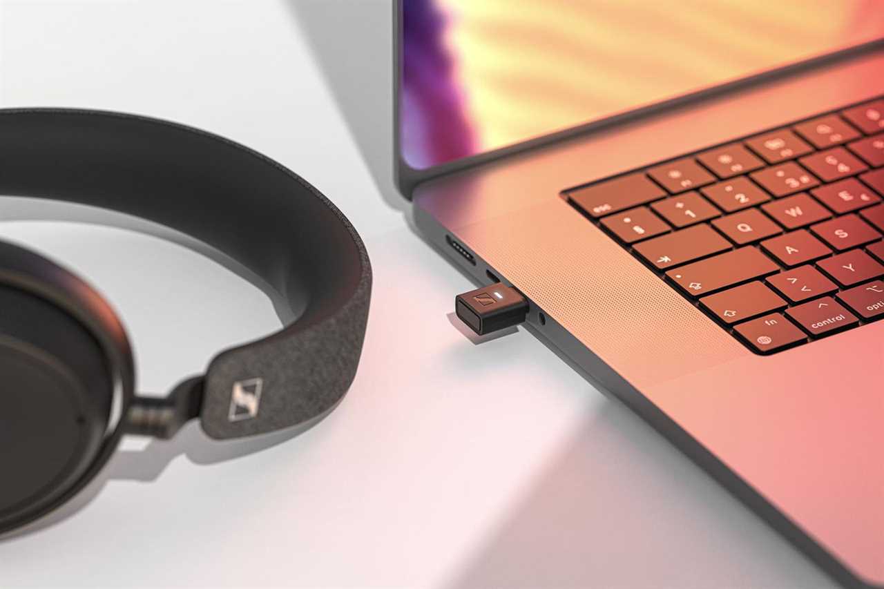 Image of MacBook with aptX adaptor plugged in.