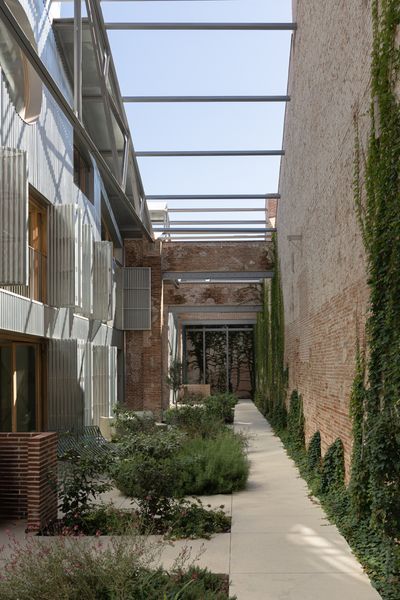 The private courtyard at the loft's entry offers respite from the neighborhood's active streets.
