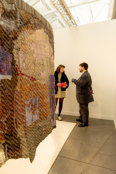 A fiber work by Maris Van Vlack completed the space, suggesting the colors and forms of a stained-glass window. Cayce and I loved how it felt as if it was unraveling and that some of it was see-through—it reminded me that sometimes, the most beautiful moments happen when things feel like they’re coming apart.