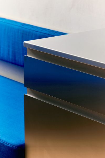 A Curvy Blue Banquette Solves a Tiny Berlin Apartment’s Puzzling Shape