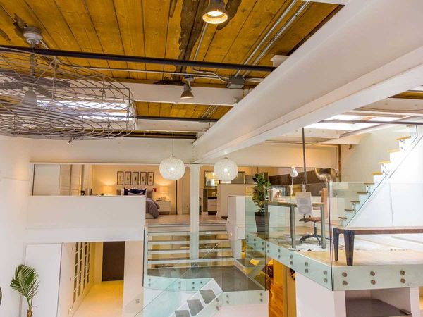 Before: Once a toy and bottling factory, this Leslieville loft had been converted into live/work spaces in the early 2000s. Exposed brick, timber ceilings, and soaring volumes remained, but the space felt worn, functional, and ready for transformation.