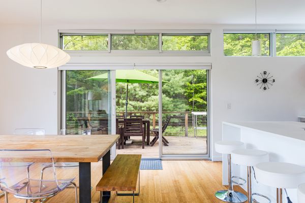 In addition to the ground floor pool deck, the second floor extends outdoors to an elevated patio.