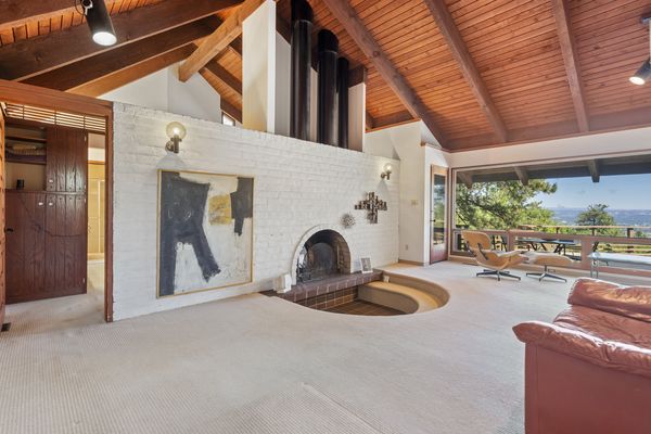 The fireplace is made from slump stone, which are removed from their molds before drying, giving them unique shapes.